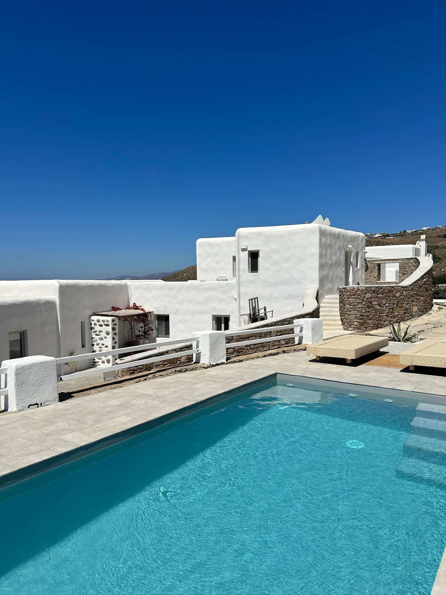 Whitewashed Mediterranean villa above a private pool